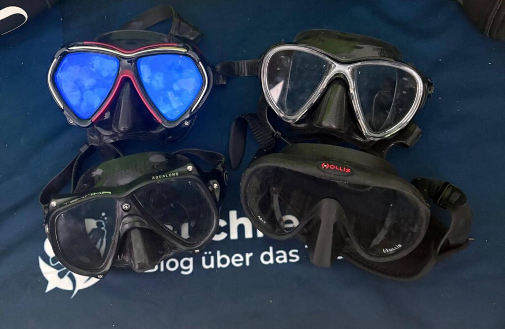 Aqualung Teknika liegt zum Vergleich neben den Hollis M1, Cressi Big Eyes und TUSA Paragon Tauchmasken
